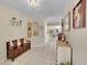 Inviting entryway with tiled floors, bench seating, and decorative mirrors creating a warm and welcoming ambiance at 2409 S Halifax Way, Aurora, CO 80013