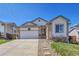 Charming single-Gathering home with a well-manicured front yard and attached two-car garage at 2409 S Halifax Way, Aurora, CO 80013