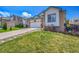 This single-Gathering home has a well-maintained lawn, and an attached two-car garage at 2409 S Halifax Way, Aurora, CO 80013