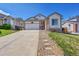 Inviting single-Gathering home featuring a two-car garage and a meticulously maintained front yard at 2409 S Halifax Way, Aurora, CO 80013
