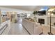 Open concept living room with a fireplace, comfortable seating, and seamless flow into the dining and kitchen areas at 2409 S Halifax Way, Aurora, CO 80013