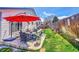 Outdoor patio features comfortable seating and a dining area, perfect for relaxing or entertaining guests at 2409 S Halifax Way, Aurora, CO 80013