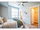 Inviting bedroom with plush bedding, cozy decor, and ample natural light at 7928 E 54Th Pl, Denver, CO 80238