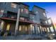 Modern townhomes with private balconies offer stylish urban living in a vibrant community at 7928 E 54Th Pl, Denver, CO 80238