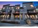 Modern townhomes with private balconies, offering stylish urban living in a vibrant community at 7928 E 54Th Pl, Denver, CO 80238