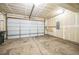 A spacious garage is equipped with an automatic door and ample room for storage at 7928 E 54Th Pl, Denver, CO 80238