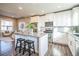 Modern kitchen with granite island is perfect for cooking and entertaining in an open-concept home at 7928 E 54Th Pl, Denver, CO 80238
