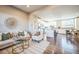 Open-concept living room and kitchen with seamless flow, perfect for modern living and entertaining guests at 7928 E 54Th Pl, Denver, CO 80238