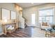 Bright living room features stylish decor, modern lighting, and neutral tones that create a warm ambiance at 7928 E 54Th Pl, Denver, CO 80238