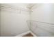 A spacious walk-in closet boasts wire shelving and neutral carpeting at 7928 E 54Th Pl, Denver, CO 80238
