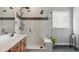 Bathroom with double vanity, walk-in shower, and built-in shelving at 616 Scrubjay Cir, Castle Rock, CO 80104