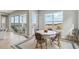 Bright dining area with a round table and chairs, overlooking scenic views at 616 Scrubjay Cir, Castle Rock, CO 80104