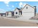 Street view of attractive light gray single-Gathering home featuring a two-car garage and minimalist landscaping at 616 Scrubjay Cir, Castle Rock, CO 80104