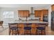 Modern kitchen featuring wood cabinets, granite countertops, and stainless steel appliances at 616 Scrubjay Cir, Castle Rock, CO 80104