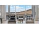 Living room with sliding doors that showcase scenic hilltop views at 616 Scrubjay Cir, Castle Rock, CO 80104