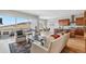 Open concept living and kitchen area with hardwood floors and views at 616 Scrubjay Cir, Castle Rock, CO 80104