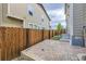 Fenced backyard with patio, wooden fence, and stairway to the left at 2356 W 165Th Pl, Broomfield, CO 80023