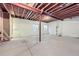 Unfinished basement with exposed ceiling, concrete floor, and two windows at 2356 W 165Th Pl, Broomfield, CO 80023