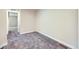Cozy bedroom with neutral walls, plush carpet, and view into the hallway at 2356 W 165Th Pl, Broomfield, CO 80023