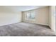Spacious bedroom with neutral paint, plush carpet, and a large window at 2356 W 165Th Pl, Broomfield, CO 80023