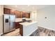 Modern kitchen with stainless steel appliances, an island, and ample cabinet space at 2356 W 165Th Pl, Broomfield, CO 80023
