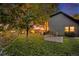 Large backyard with trees and a garden offering a private outdoor space at 8691 Bluebunch Ct, Parker, CO 80134