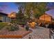 Outdoor patio with stone pavers, dining table, and charming decor perfect for alfresco dining and relaxation at 8691 Bluebunch Ct, Parker, CO 80134