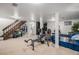 Finished basement features laundry, gym area, bedroom area and closet at 8691 Bluebunch Ct, Parker, CO 80134