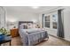 Cozy bedroom features a queen size bed, neutral walls and carpet, and good natural light at 8691 Bluebunch Ct, Parker, CO 80134