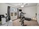 Bedroom featuring exercise equipment, neutral carpeting, and two windows at 8691 Bluebunch Ct, Parker, CO 80134