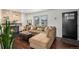 Comfortable living room with a stone fireplace and a large sectional sofa at 8691 Bluebunch Ct, Parker, CO 80134