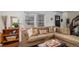 Inviting living room with a comfortable sectional sofa, large windows, and stylish decor at 8691 Bluebunch Ct, Parker, CO 80134