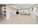 Basement area with an open layout, shelving, seating, and a play area at 9169 Fox Fire Way, Highlands Ranch, CO 80129