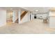 Spacious finished basement with carpeting, stairs, adjacent bedroom, and cozy seating area at 9169 Fox Fire Way, Highlands Ranch, CO 80129