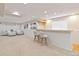 Finished basement featuring a carpeted floor, a bar with seating, and a comfortable lounge area at 9169 Fox Fire Way, Highlands Ranch, CO 80129