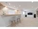 Basement bar area offering a relaxed atmosphere and bar seating at 9169 Fox Fire Way, Highlands Ranch, CO 80129