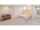 Cozy bedroom with neutral carpeting, closet, and a bright, floral comforter, creating a welcoming space at 9169 Fox Fire Way, Highlands Ranch, CO 80129
