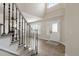 Well-lit foyer with a modern front door, window shutters, and hardwood flooring at 9169 Fox Fire Way, Highlands Ranch, CO 80129