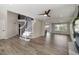 Open-concept foyer with staircase, hardwood floors and views into other living areas at 9169 Fox Fire Way, Highlands Ranch, CO 80129