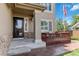 Cozy front porch with stone accents, offering a welcoming entrance to the home at 9169 Fox Fire Way, Highlands Ranch, CO 80129
