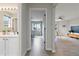 Hallway between bathroom and bedroom offering great lighting and a seamless transition between rooms at 9169 Fox Fire Way, Highlands Ranch, CO 80129
