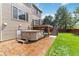 Backyard patio with a hot tub, offering a relaxing and private outdoor experience at 9169 Fox Fire Way, Highlands Ranch, CO 80129