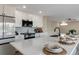 Kitchen island with countertop dining, modern backsplash and stainless appliances at 9169 Fox Fire Way, Highlands Ranch, CO 80129