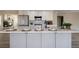 Kitchen island with bar seating, pendant lighting, and an open layout at 9169 Fox Fire Way, Highlands Ranch, CO 80129