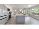 Spacious kitchen with stainless steel appliances and a large island with sink at 9169 Fox Fire Way, Highlands Ranch, CO 80129