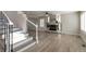 Bright living room featuring hardwood floors, a fireplace, and large windows at 9169 Fox Fire Way, Highlands Ranch, CO 80129