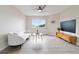 Bright living room with hardwood floors, contemporary furniture, and a large window with a view at 9169 Fox Fire Way, Highlands Ranch, CO 80129