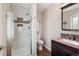 Bathroom featuring a tiled stand up shower, modern toilet, and granite vanity at 12752 W Asbury Pl, Lakewood, CO 80228