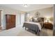 Bedroom with neutral color scheme, closet, and ample light at 12752 W Asbury Pl, Lakewood, CO 80228