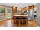 Modern kitchen with stainless steel appliances, granite countertops, and a center island at 12752 W Asbury Pl, Lakewood, CO 80228